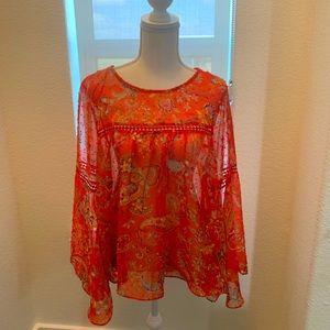 Woman’s blouse with flowy sleeves